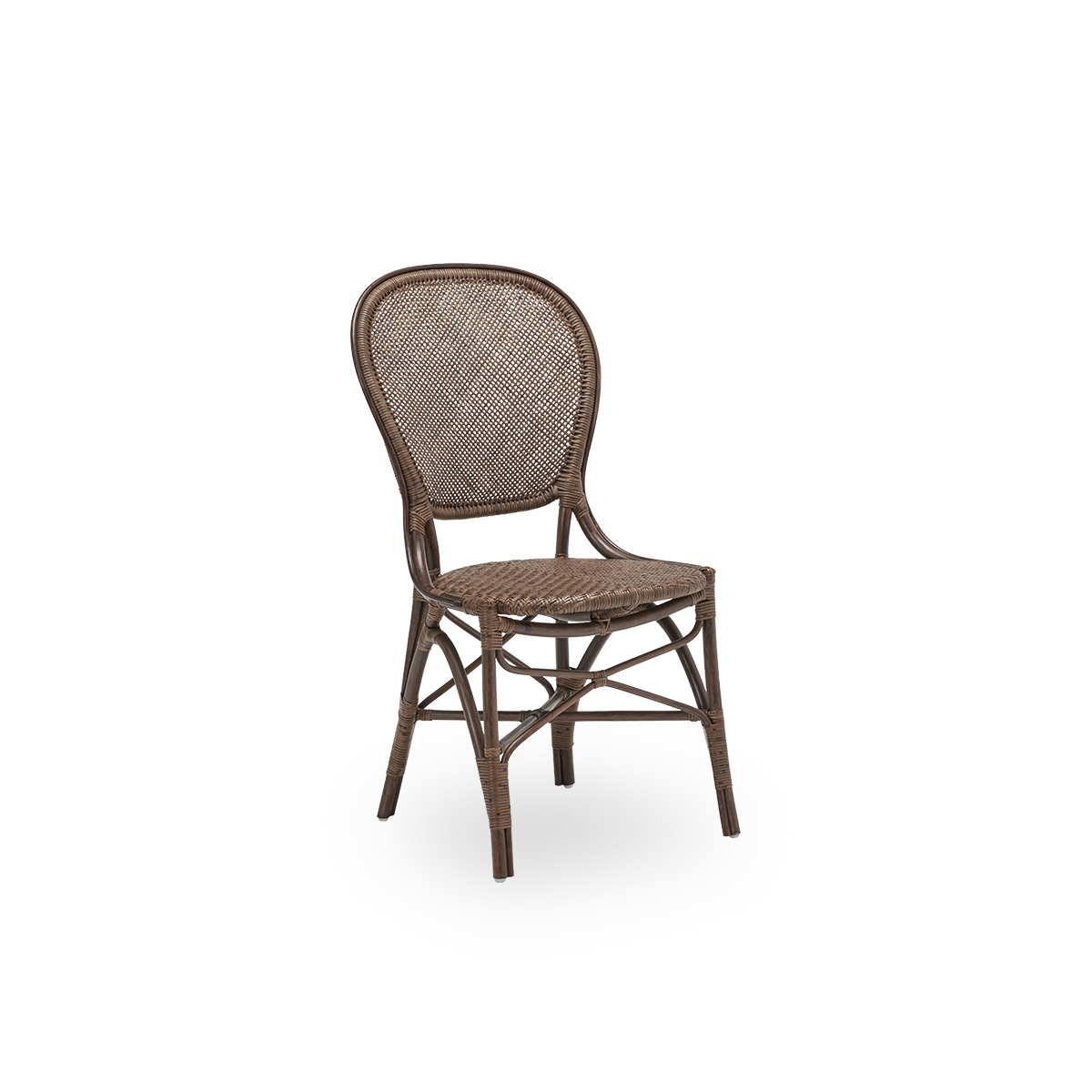 Side view of the Rossini dining chair, in brown rattan. Designed in 1993 by Knud Andreasen of Sika-Design together with Japanese designer Yamakawa, it is the brand's signature chair. Handcrafted from high-quality Indonesian rattan.
