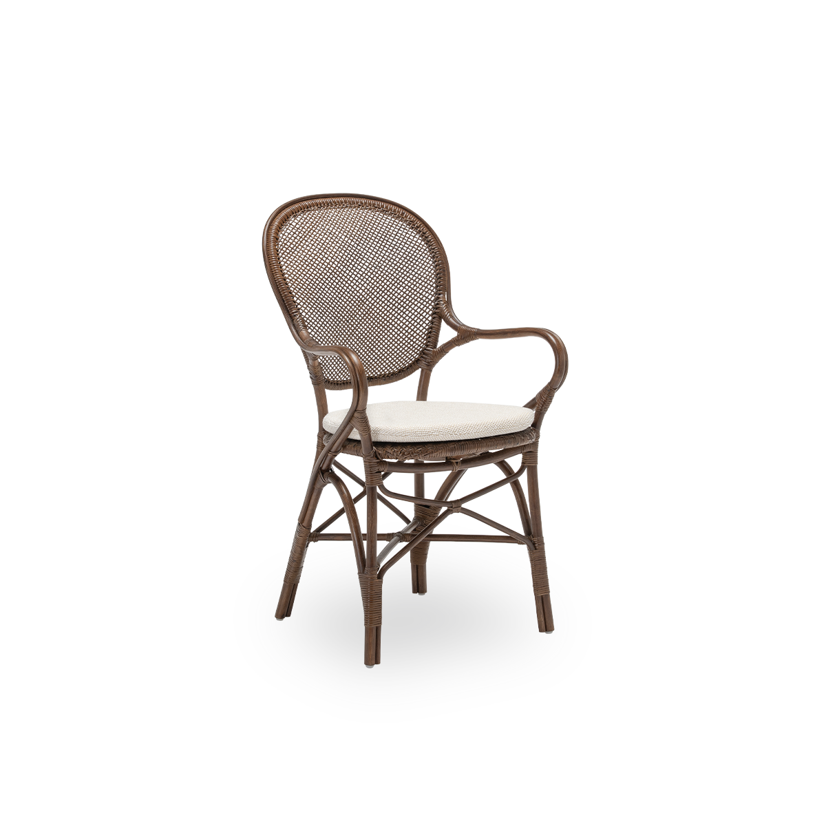 Side view of the Rossini dining armchair with seat cushion, in brown rattan. Designed in 1993 by Knud Andreasen of Sika-Design together with Japanese designer Yamakawa, it is the brand's signature chair. Handcrafted from high-quality Indonesian rattan.