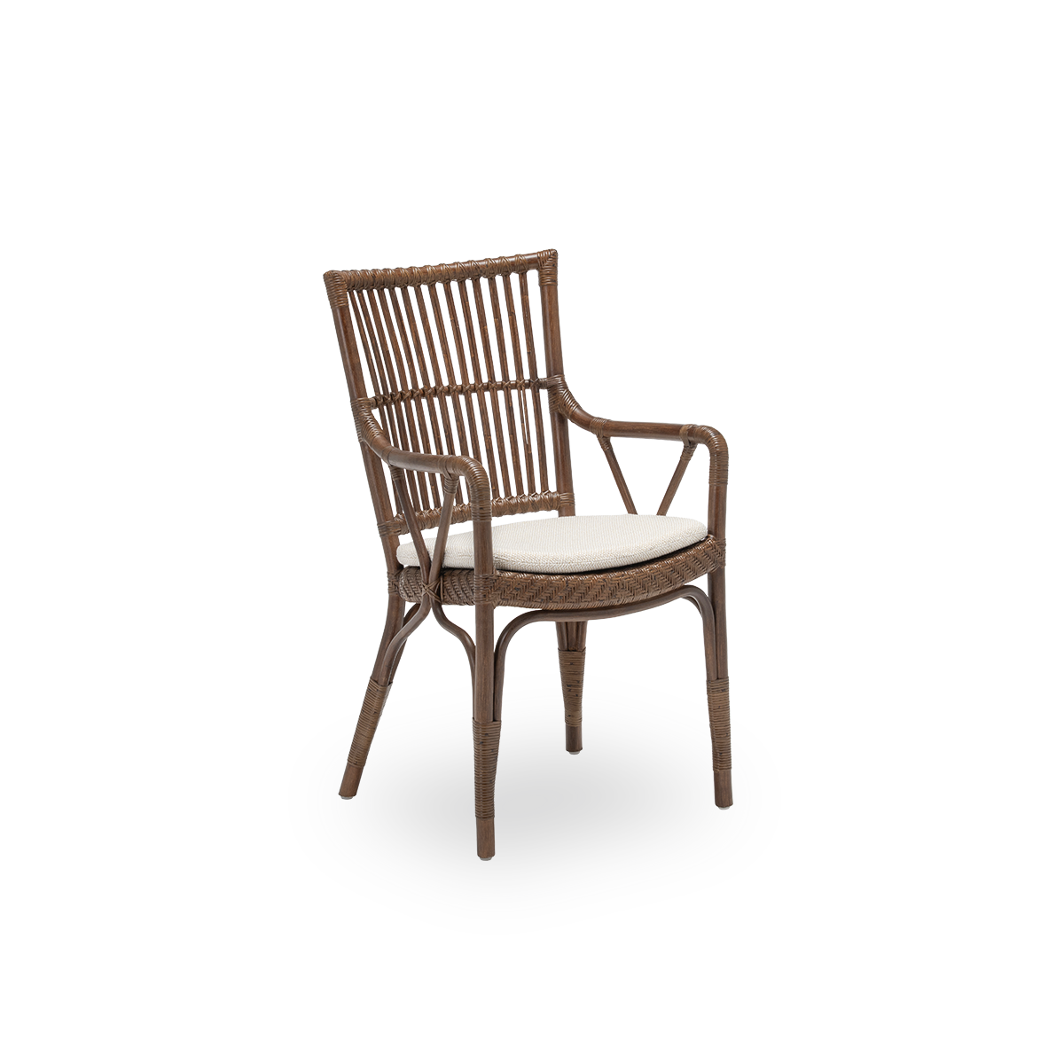 Side view of the Piano dining chair with seat cushion, in brown rattan. Danish design from Sika-Design's Originals collection, where the detailed wicker windings give the chair its character. Handcrafted from high-quality Indonesian rattan.