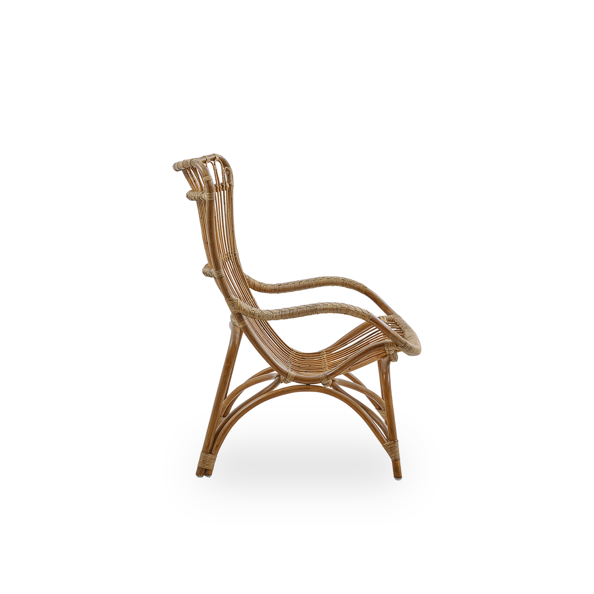 Plain side view of Monet lounge chair with high backrest and armrests presented in Antique brown color. Handcrafted from high-quality Indonesian rattan.