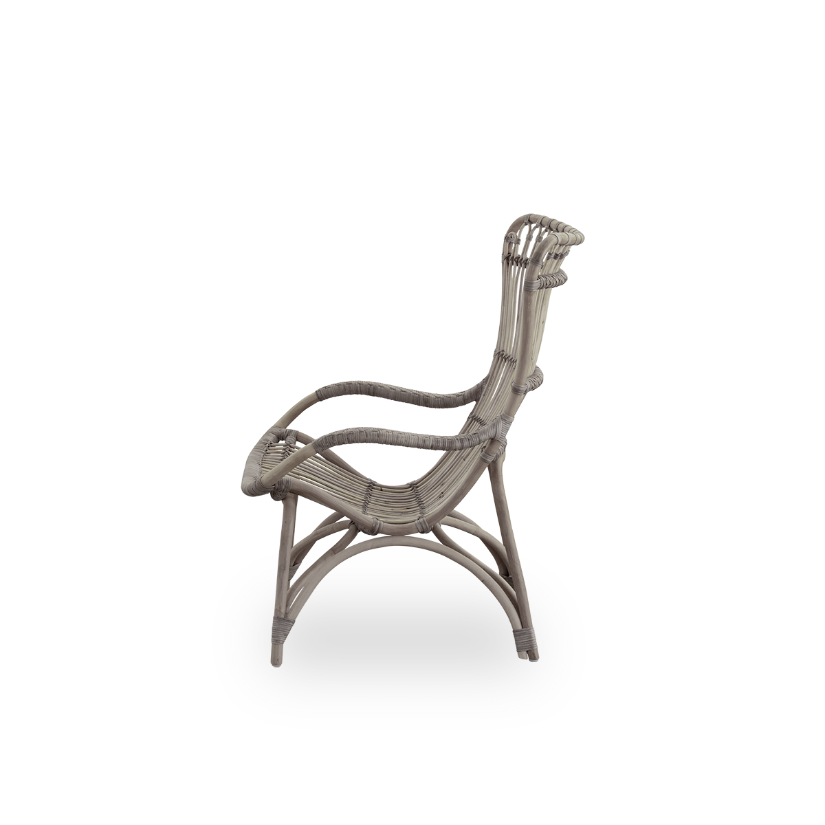 Plain side view of Monet lounge chair with high backrest and armrests presented in Taupe color. Handcrafted from high-quality Indonesian rattan.