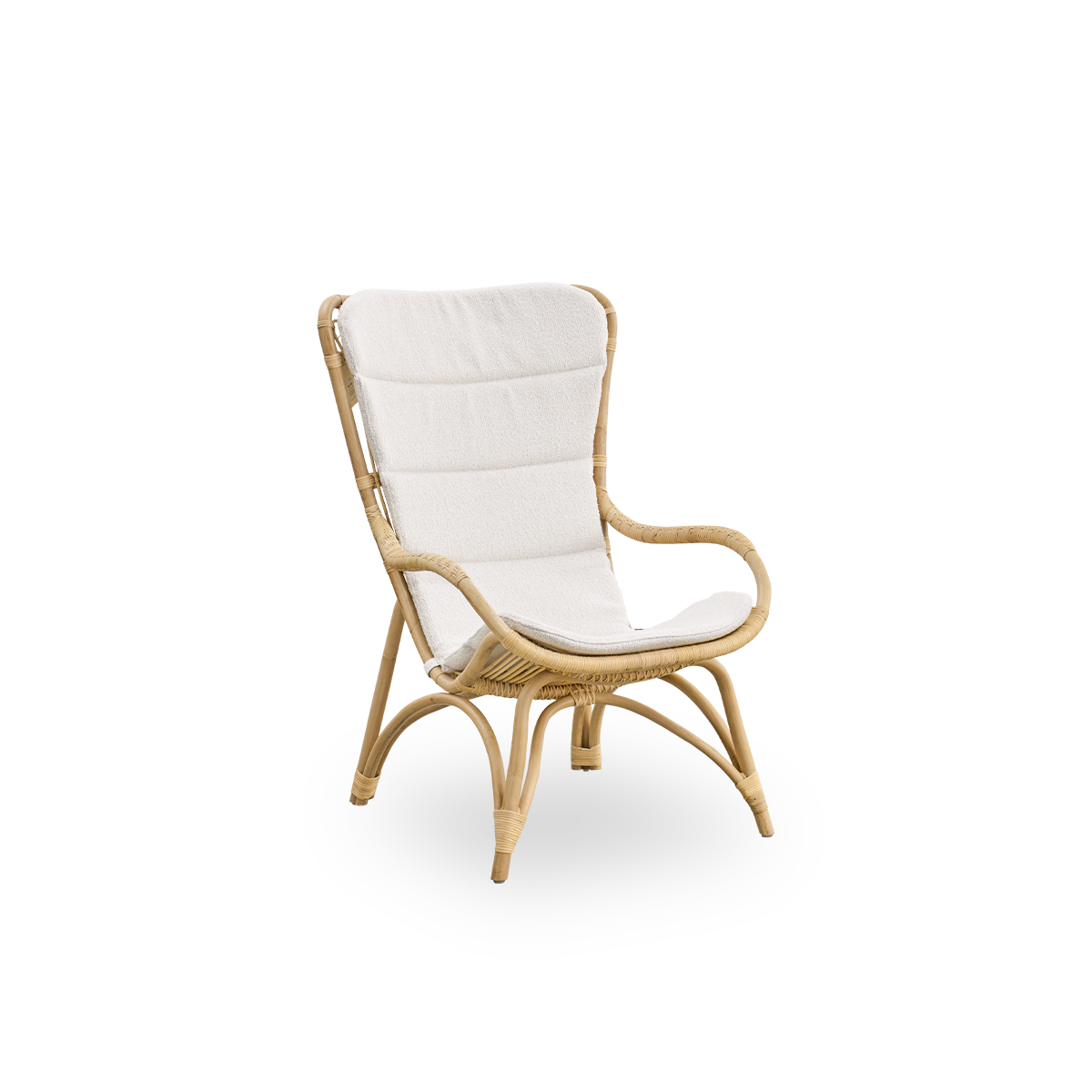 Side view of Monet lounge chair with high backrest and armrests presented in natural rattan. Handcrafted from high-quality Indonesian rattan.