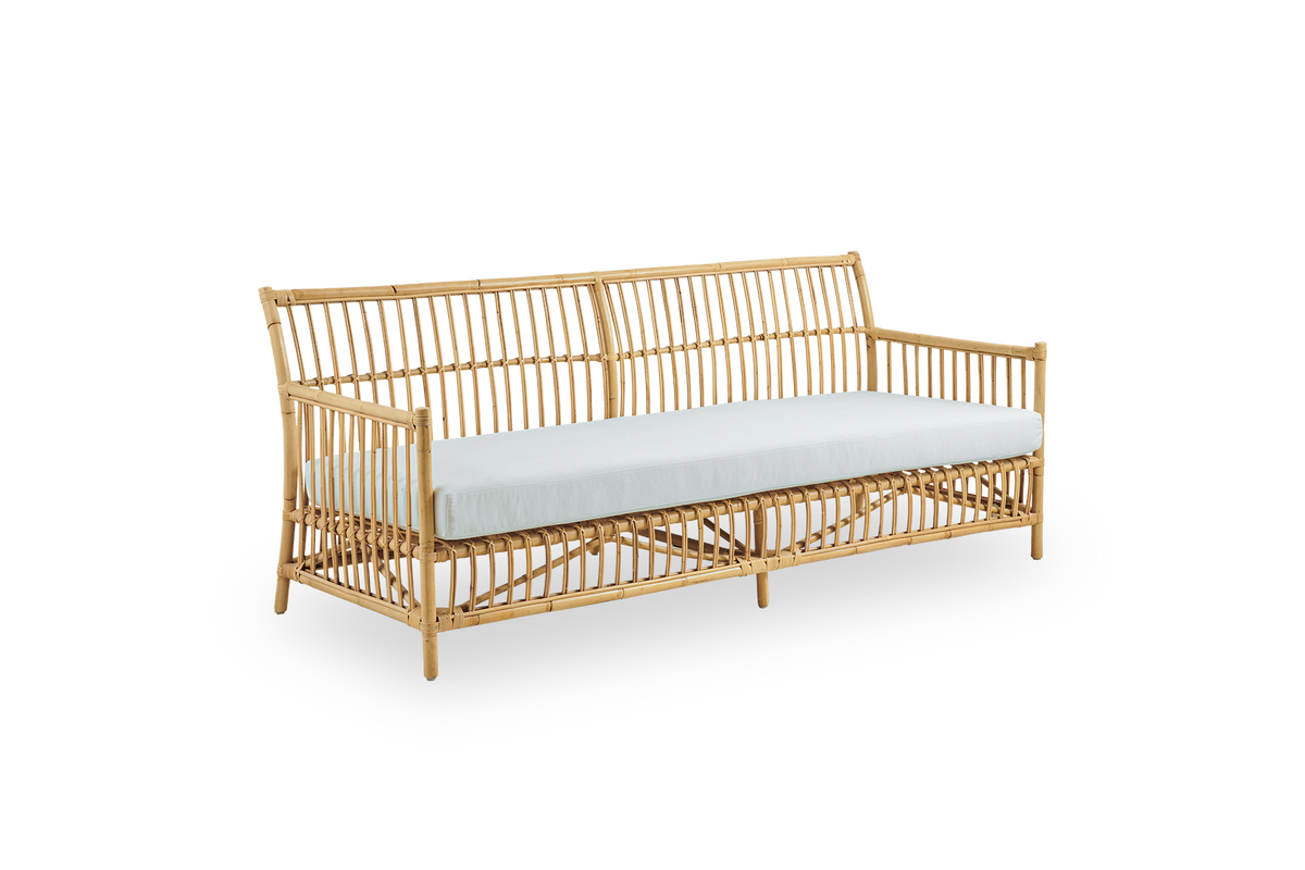 Side view of Caroline 3-seater wicker sofa, simple and elegant Danish design. Handcrafted from Indonesian rattan with detailed woven accents for a cozy, calming presence.