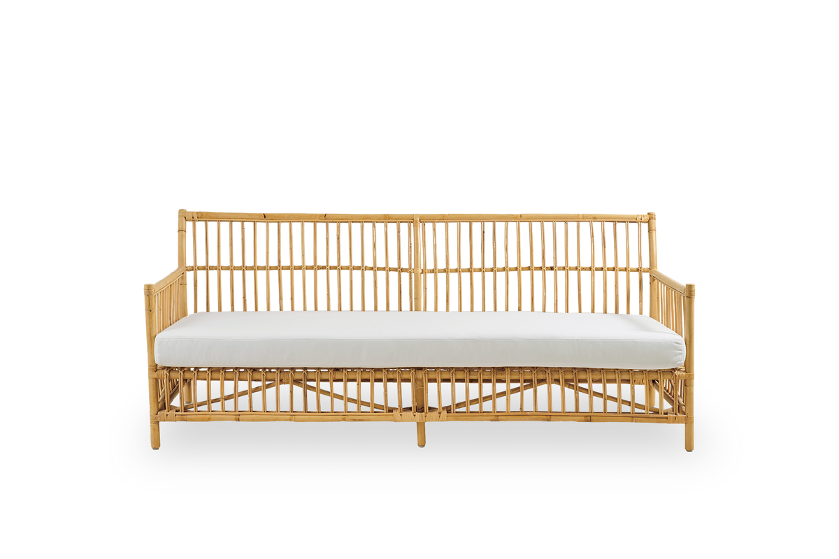 Front view of Caroline 3-seater wicker sofa, simple and elegant Danish design. Handcrafted from Indonesian rattan with detailed woven accents for a cozy, calming presence.