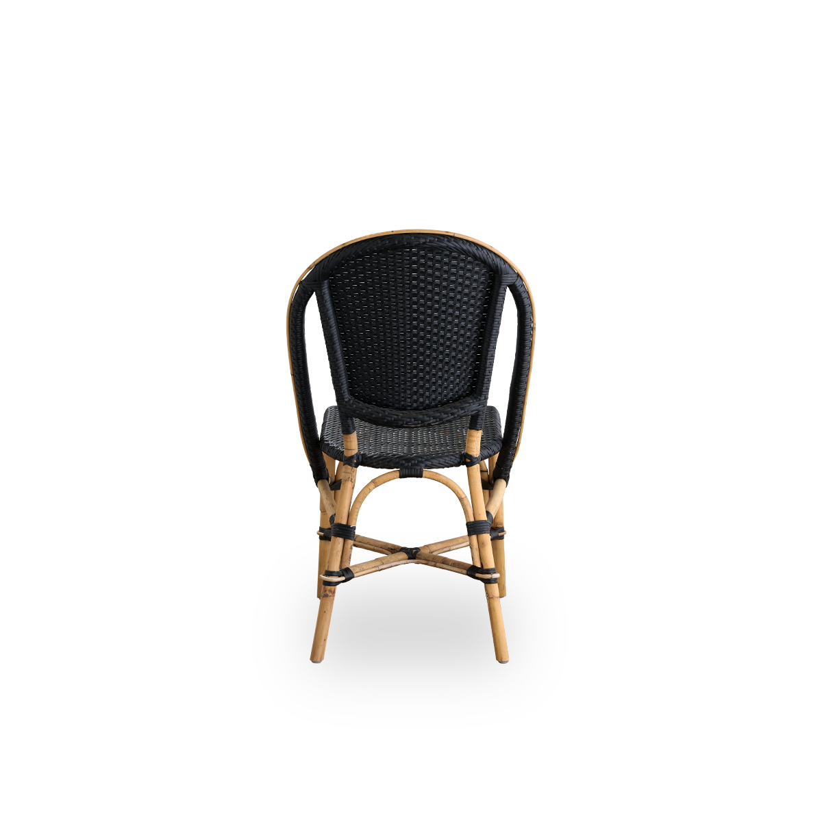 Plain back view of Sofie rattan dining chair inspired by French café style. Rattan frame with fully woven seat and backrest handcrafted in ArtFibre in black color. Stackable rattan bistro chair.
