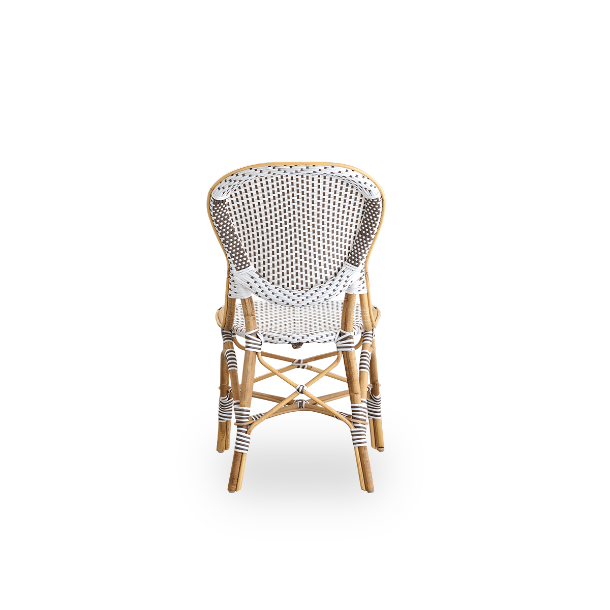 Plain back view of Isabell dining chair. Rattan frame with seat and backrest made in white ArtFibre with brown dots. Inspired by 1950s bistro design.