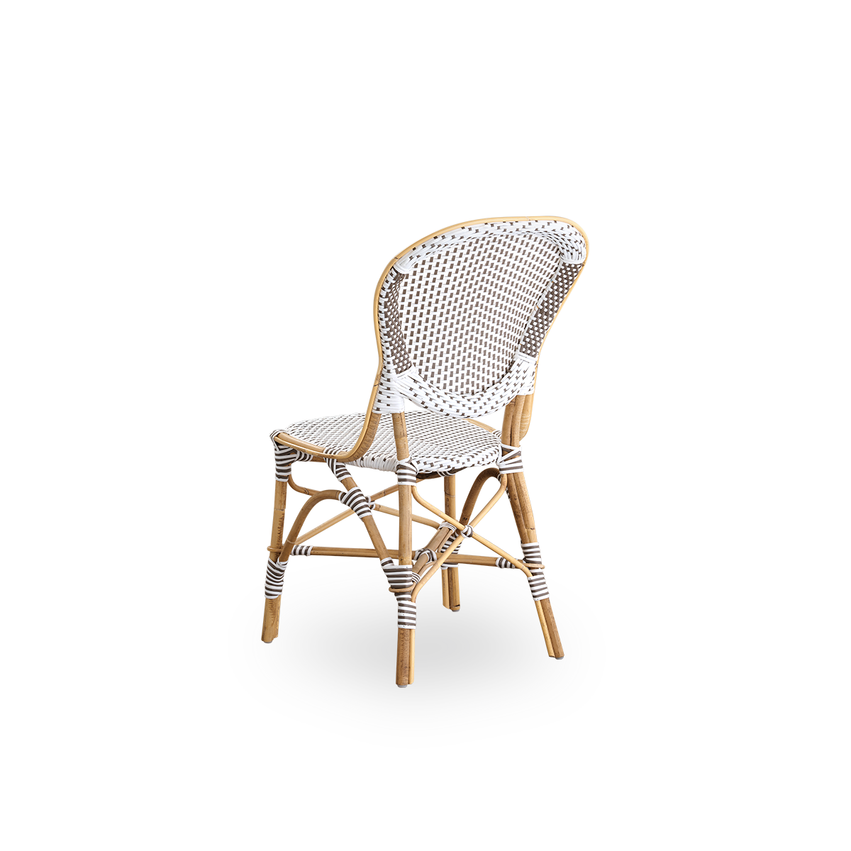 Back side view of the Isabell dining chair.
Rattan frame with seat and backrest made in white ArtFibre with brown dots. Inspired by 1950s bistro design.