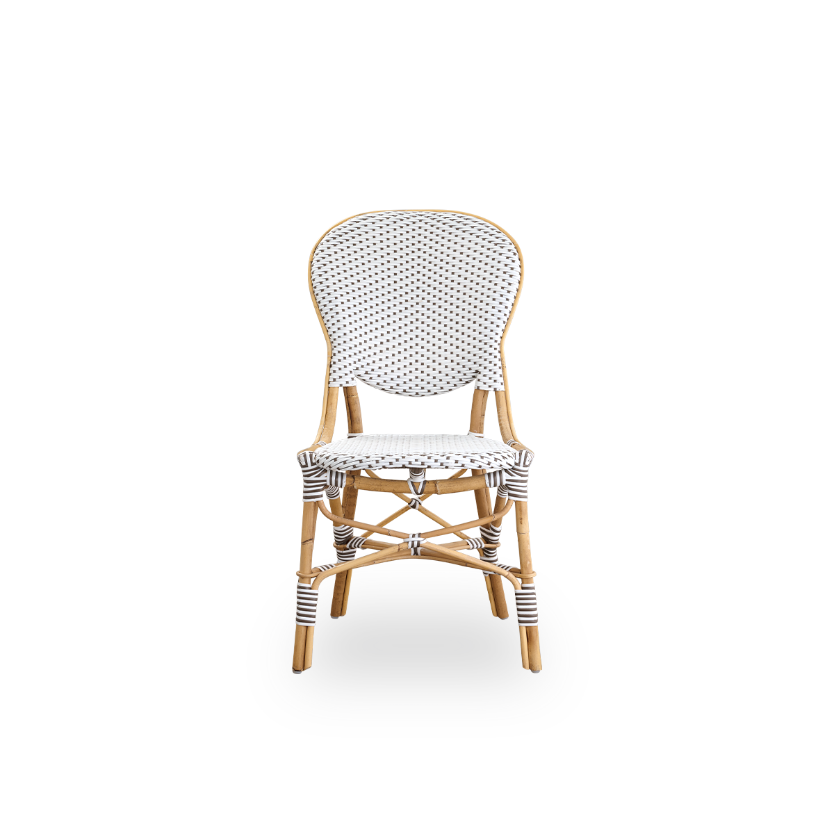 Front view of the Isabell dining chair.
Rattan frame with seat and backrest made in white ArtFibre with brown dots. Inspired by 1950s bistro design.