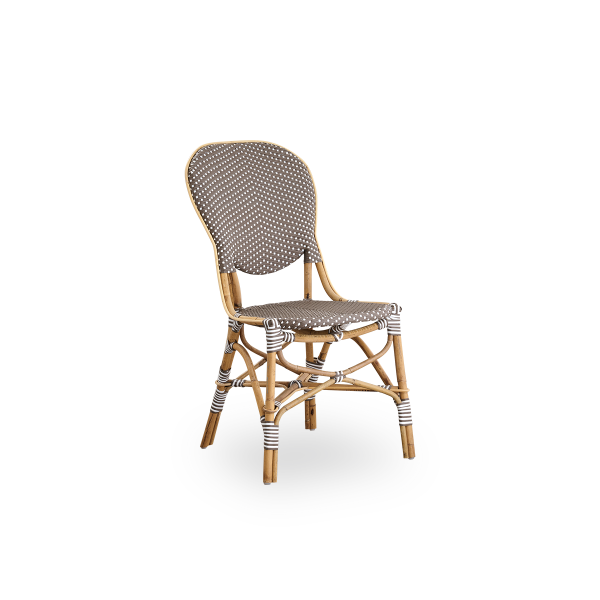 Side view of Isabell dining chair. Rattan frame with seat and backrest made in brown ArtFibre with white dots. Inspired by 1950s bistro design.