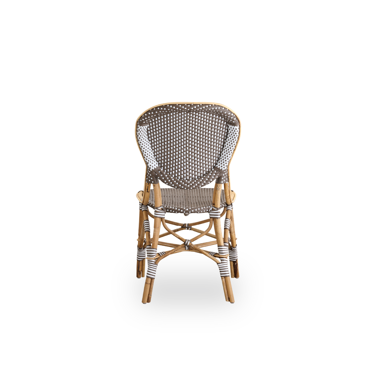 Plain back view of Isabell dining chair. Rattan frame with seat and backrest made in brown ArtFibre with white dots. Inspired by 1950s bistro design.