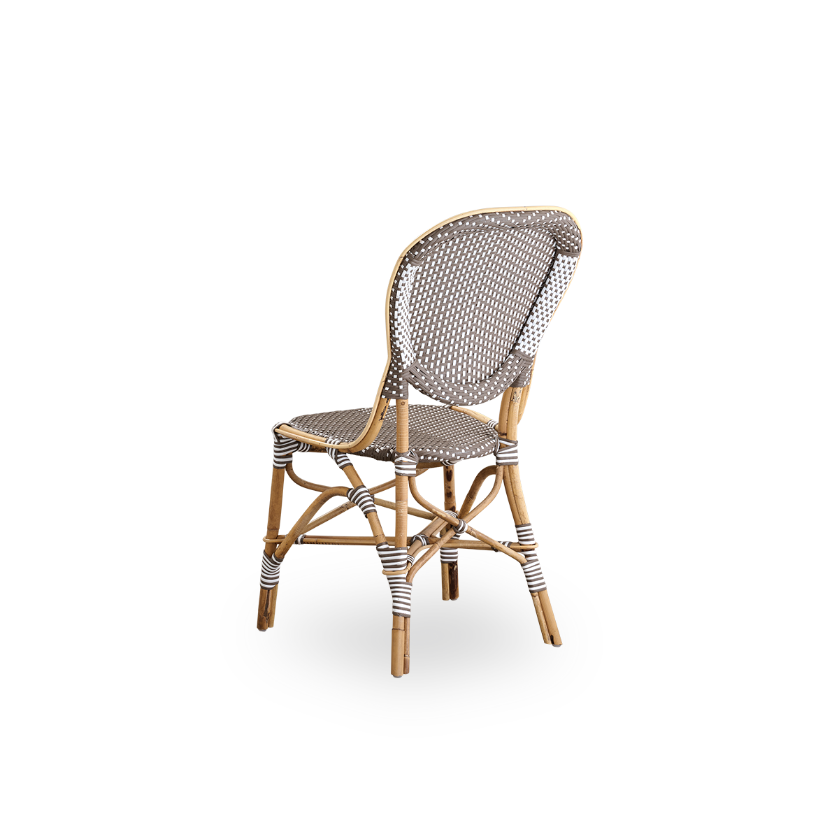 Back side view of the Isabell dining chair.
Rattan frame with seat and backrest made in brown ArtFibre with white dots. Inspired by 1950s bistro design.