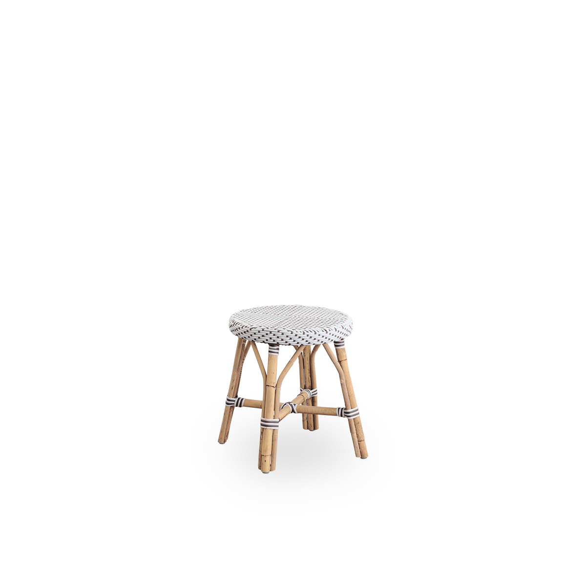 Side view of Simone stool height 52 cm. Rattan frame with footrest, with fully woven round seat handcrafted in ArtFibre in white with brown dots pattern. Stackable rattan stool.