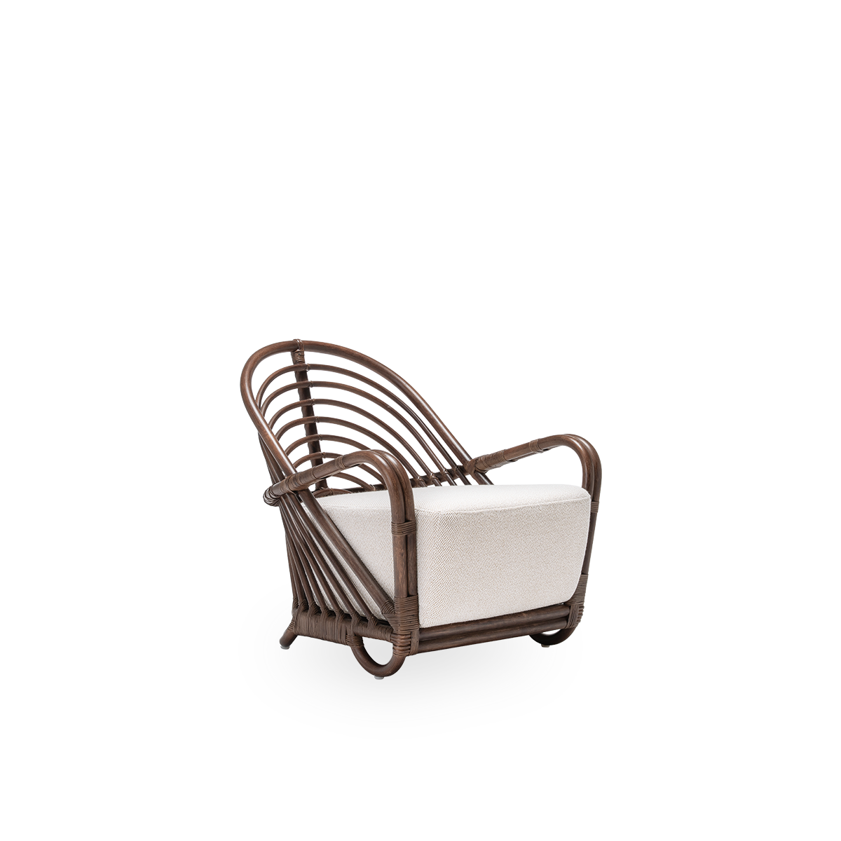Side view of the Charlottenborg lounge chair with seat cushion, in brown rattan. Designed by Arne Jacobsen in 1936 and part of Sika-Design's ICONS collection of reissued designer furniture. Handcrafted from high-quality Indonesian rattan.