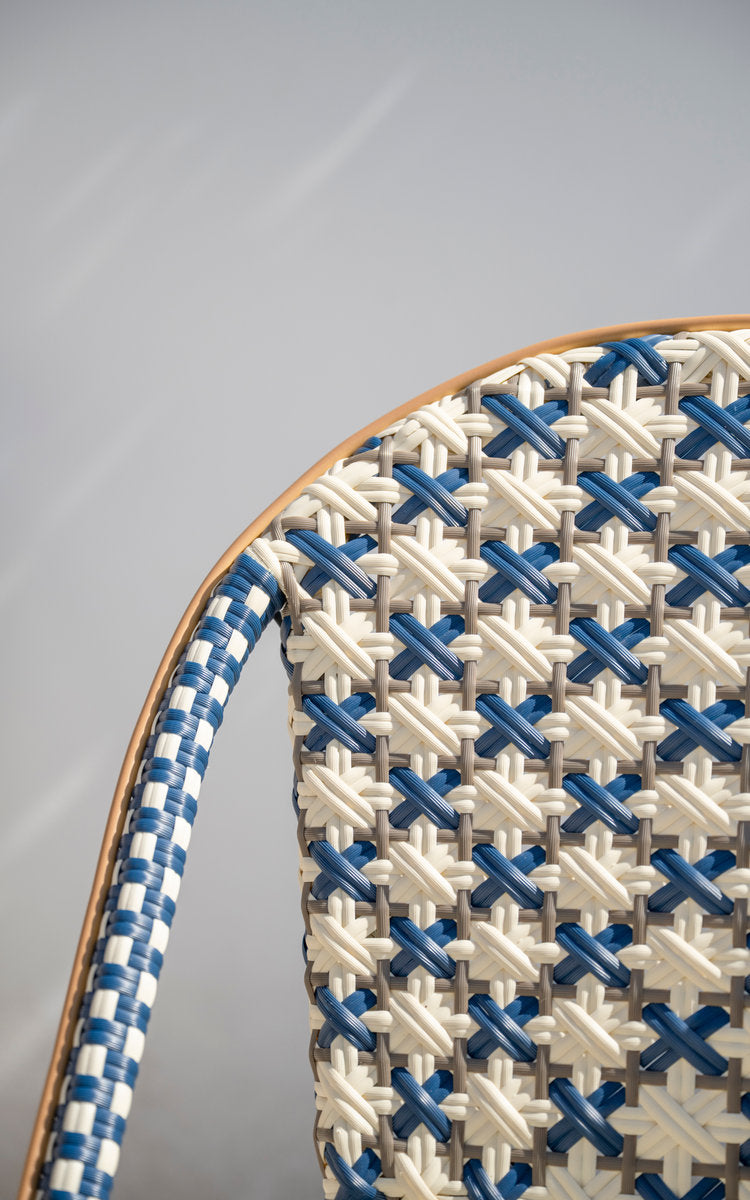 This is a close-up image of Sofie Exterior Dining Chair in almond aluminium frame starweave ivory navy blue cappuccino artfibre. Woven backrest.