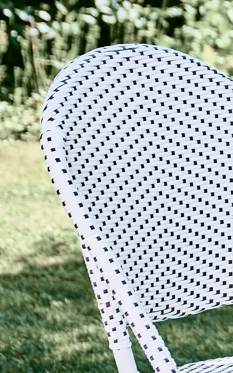 This is a close-up image of Sofie Exterior Dining Chair in white aluminium frame white w cappuccino dot artfibre.