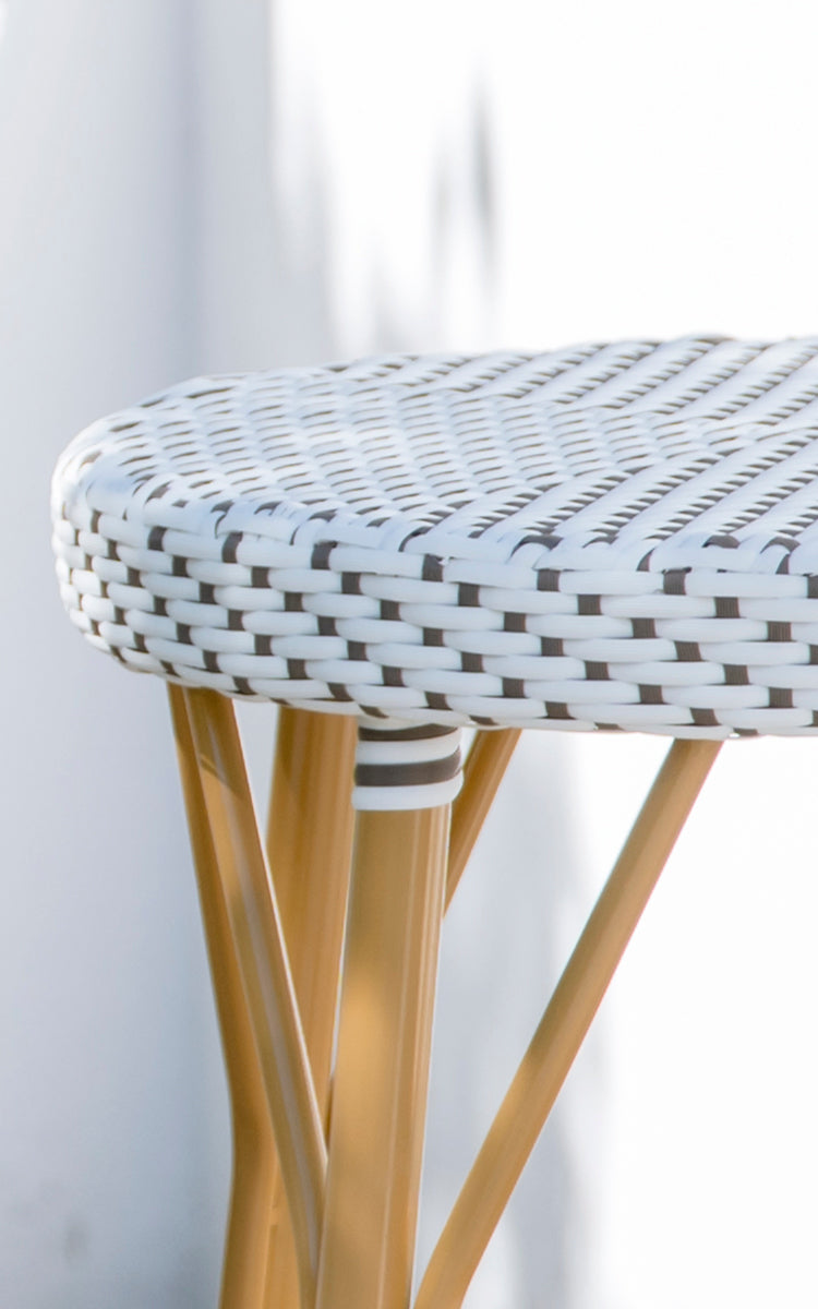 This is a close-up image of Simone Exterior Counter Stool in almond aluminium frame white w cappuccino dot artfibre.