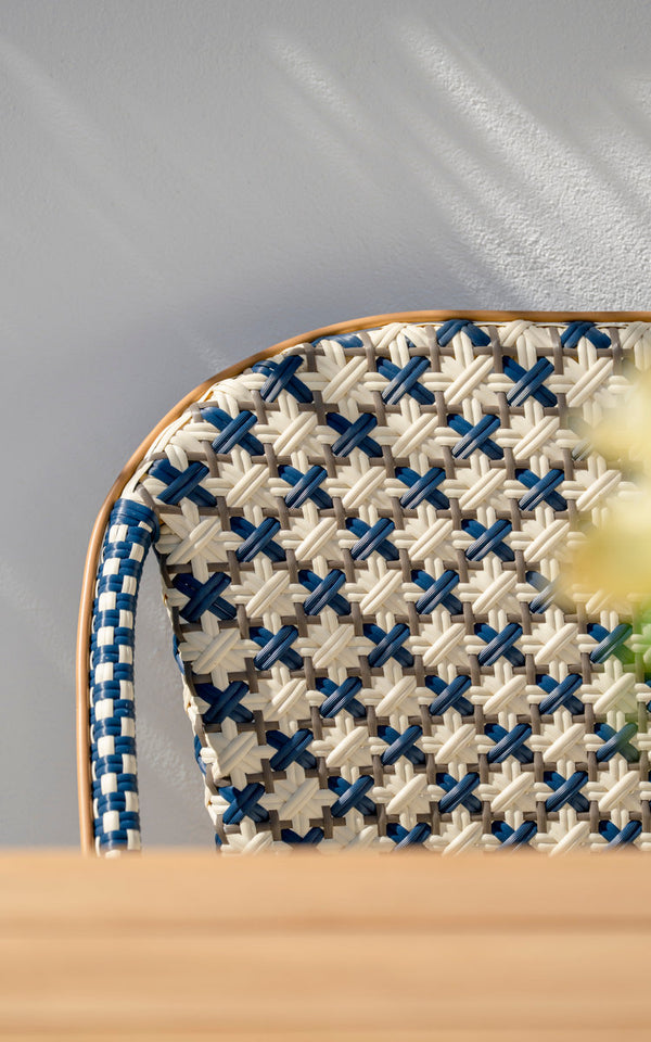 This is a close-up image of Sofie Exterior 3-Seater Bench in almond aluminium frame starweave ivory navy blue cappuccino artfibre. Woven backrest.