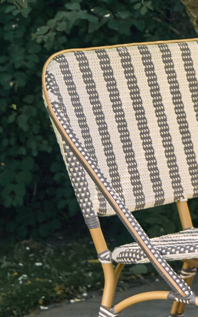 This is a close-up image of Sofie Exterior 3-Seater Bench in almond aluminium frame striped cappuccino ivory artfibre.