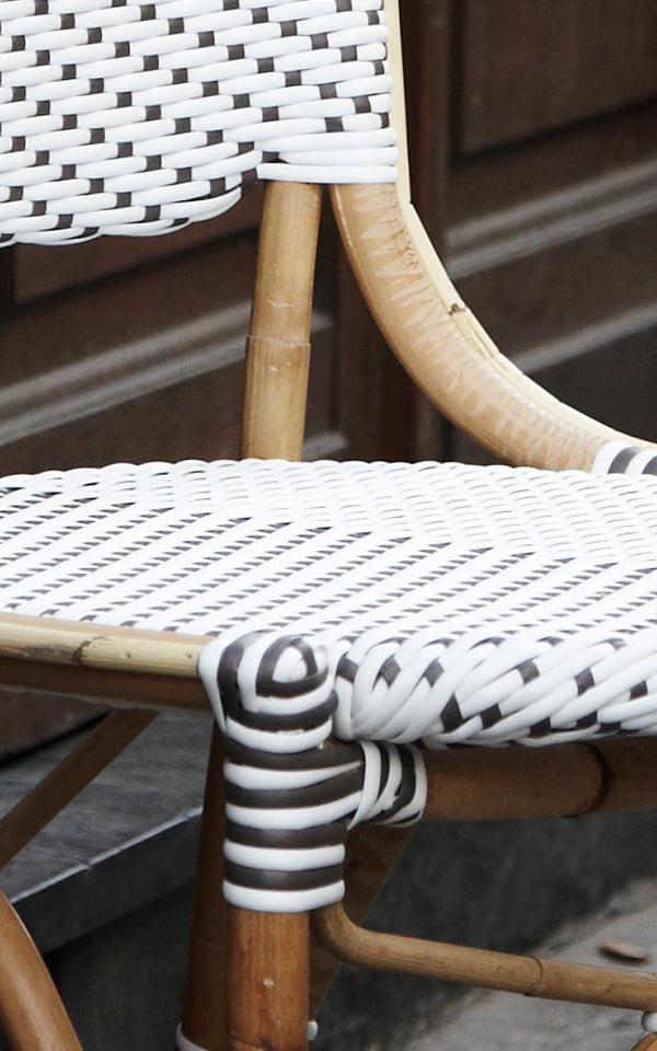 This is a close-up image of Isabell in white w cappuccino dot ArtFibre Skin on Rattan frame.
