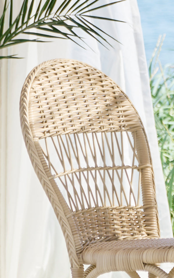 This is a close-up image of Ofelia Exterior Chair in natural artfibre aluminium. Detail of the rounded woven back and seat weave.