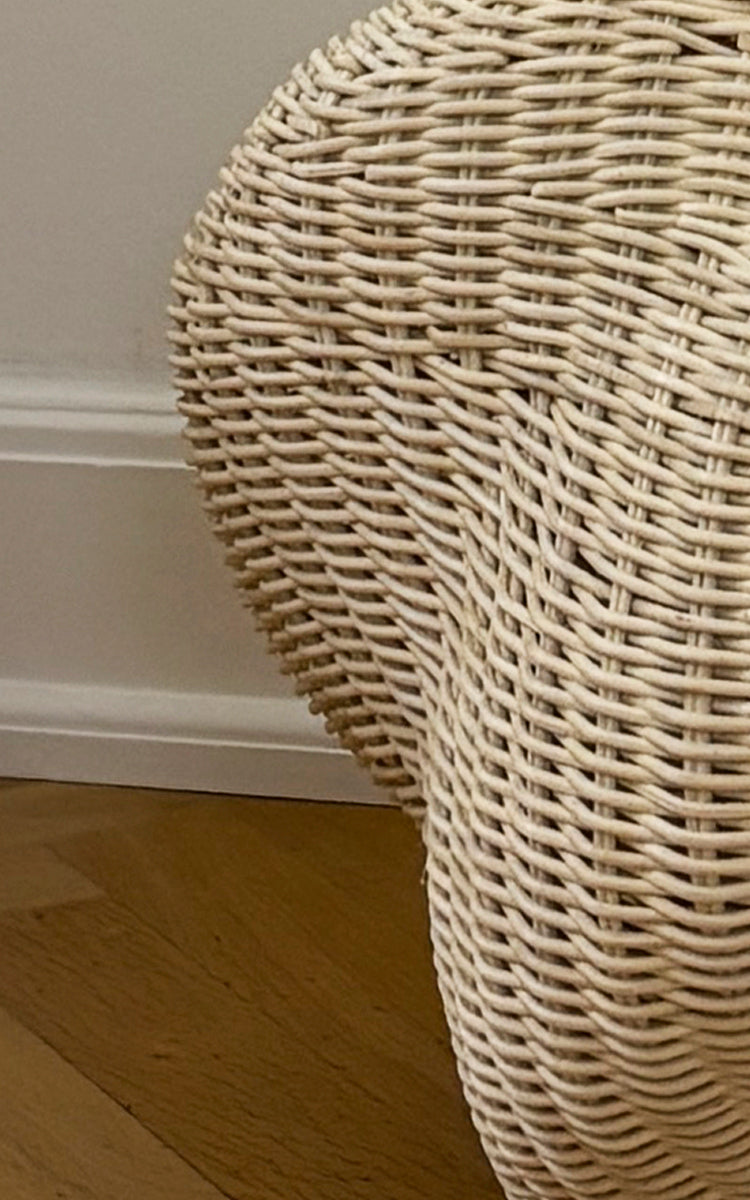 This is a close-up image of Solaris Basket Ø40 cm in natural core weave iron frame. Detail of the open rattan ring basket with vertical spokes.