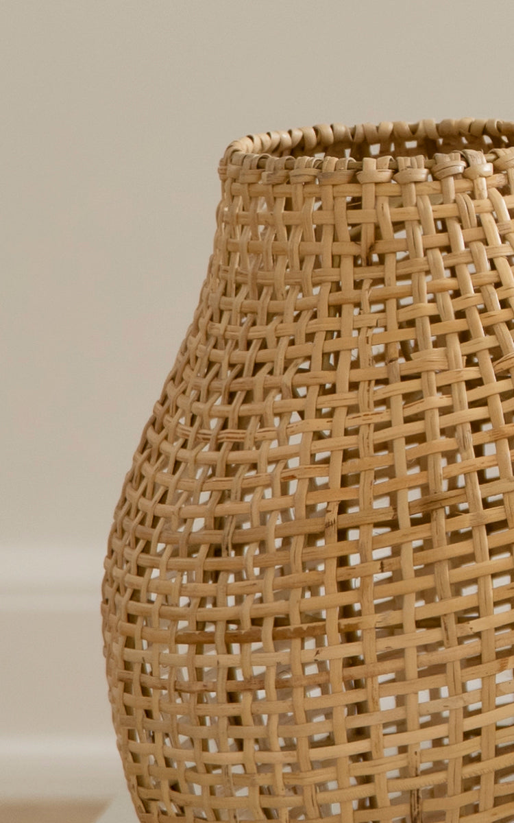 This is a close-up image of Figura Floor Lampshade in light natural weave rattan.