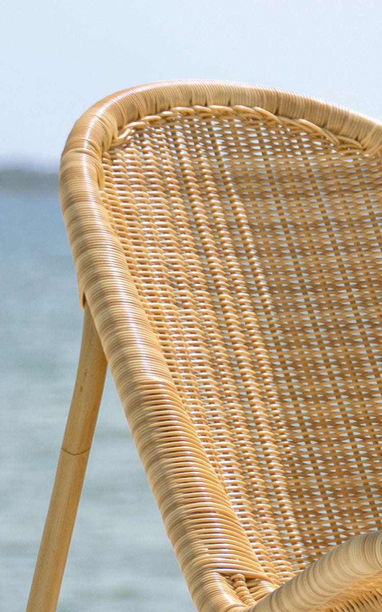 This is a close-up image of Pacifique Exterior Lounge Chair in natural core weave artfibre aluminium.