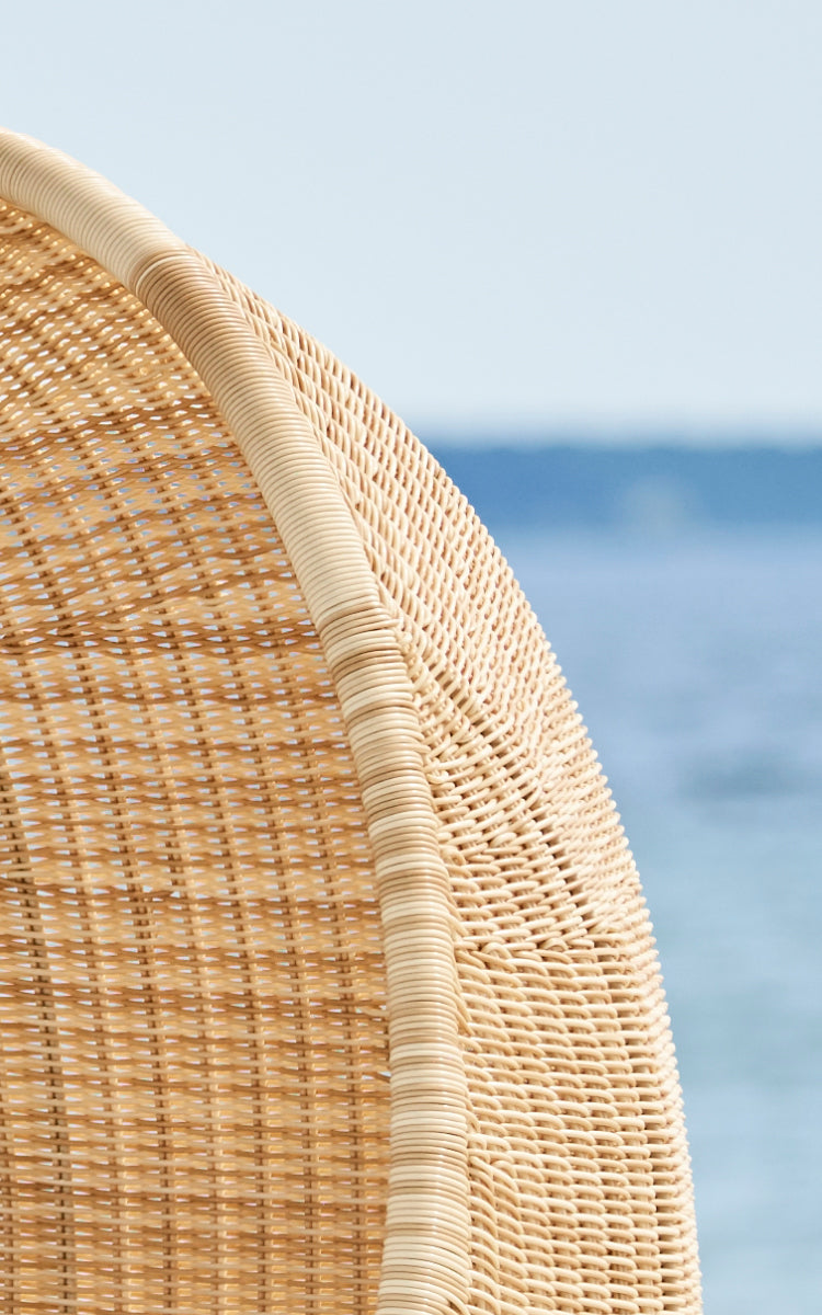 This is a close-up image of Hanging Egg Exterior Chair in natural core weave ArtFibre Aluminium.