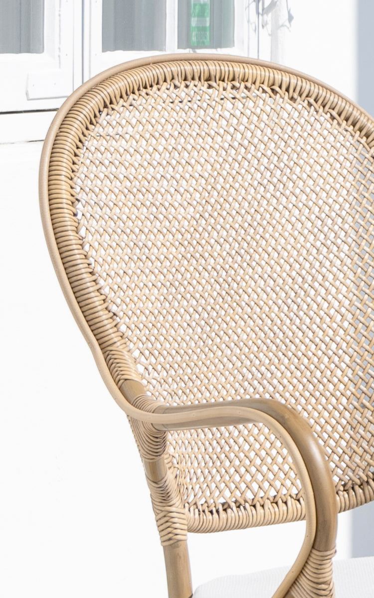 This is a close-up image of Rossini Exterior Dining Armchair in antique aluminium artfibre. Detail of the woven texture and frame construction.