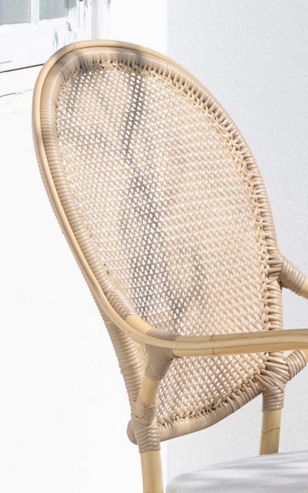 This is a close-up image of Rossini Exterior Dining Armchair in natural aluminium artfibre. Detail of the woven texture and frame construction.