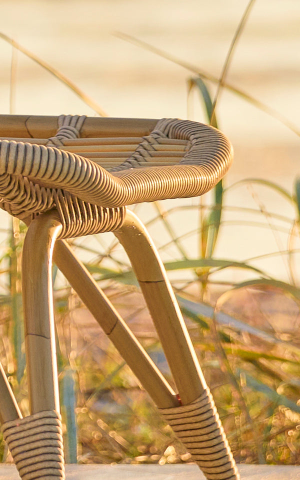 This is a close-up image of Monet Exterior Footstool in antique aluminium artfibre. Detail of the woven ArtFibre seat surface.