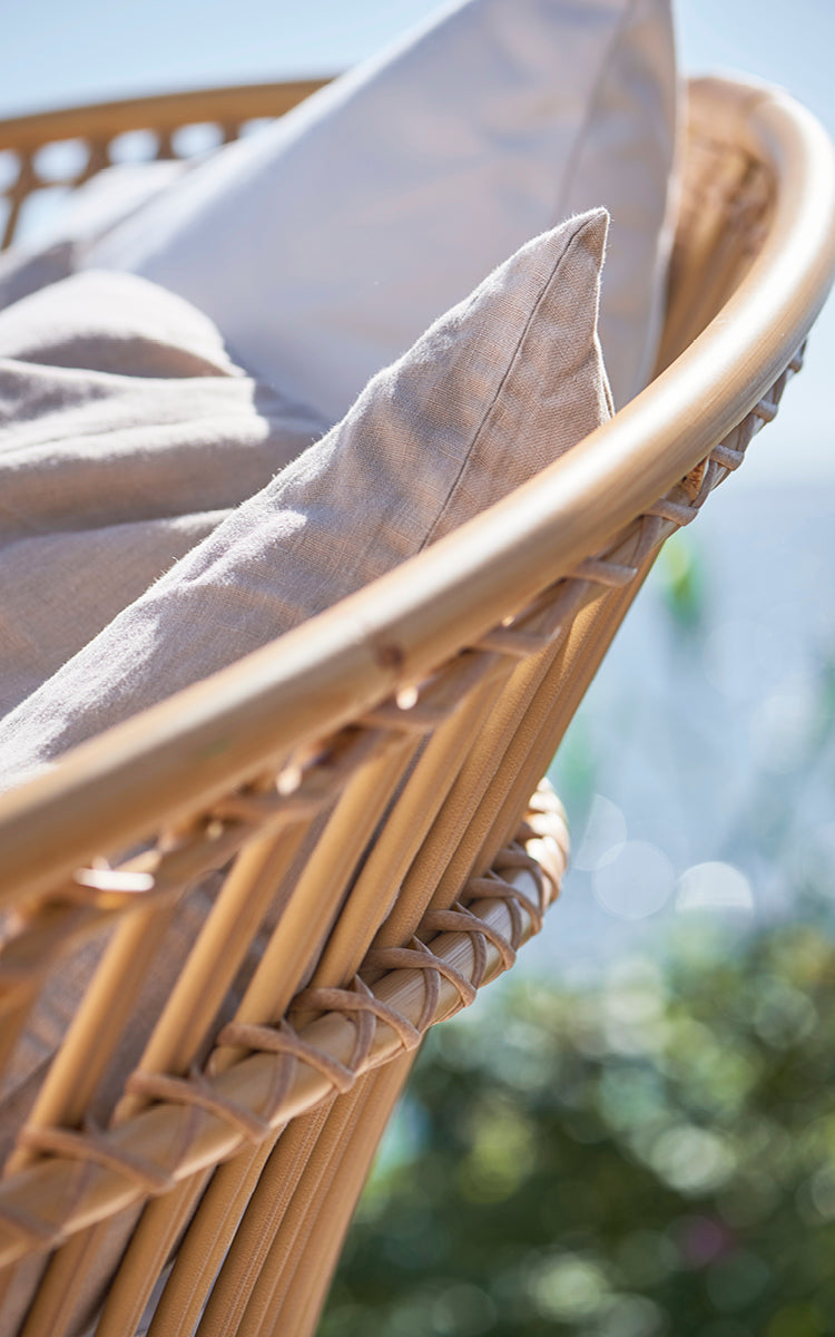 This is a close-up image of Olympia Nest Exterior in natural aluminium artfibre. Detail of the vertical rod frame and wrapped joints.