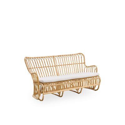 Side view of Tulip wicker sofa designed by Tove Kindt-Larsen, with soft organic lines. Handcrafted from high-quality Indonesian rattan