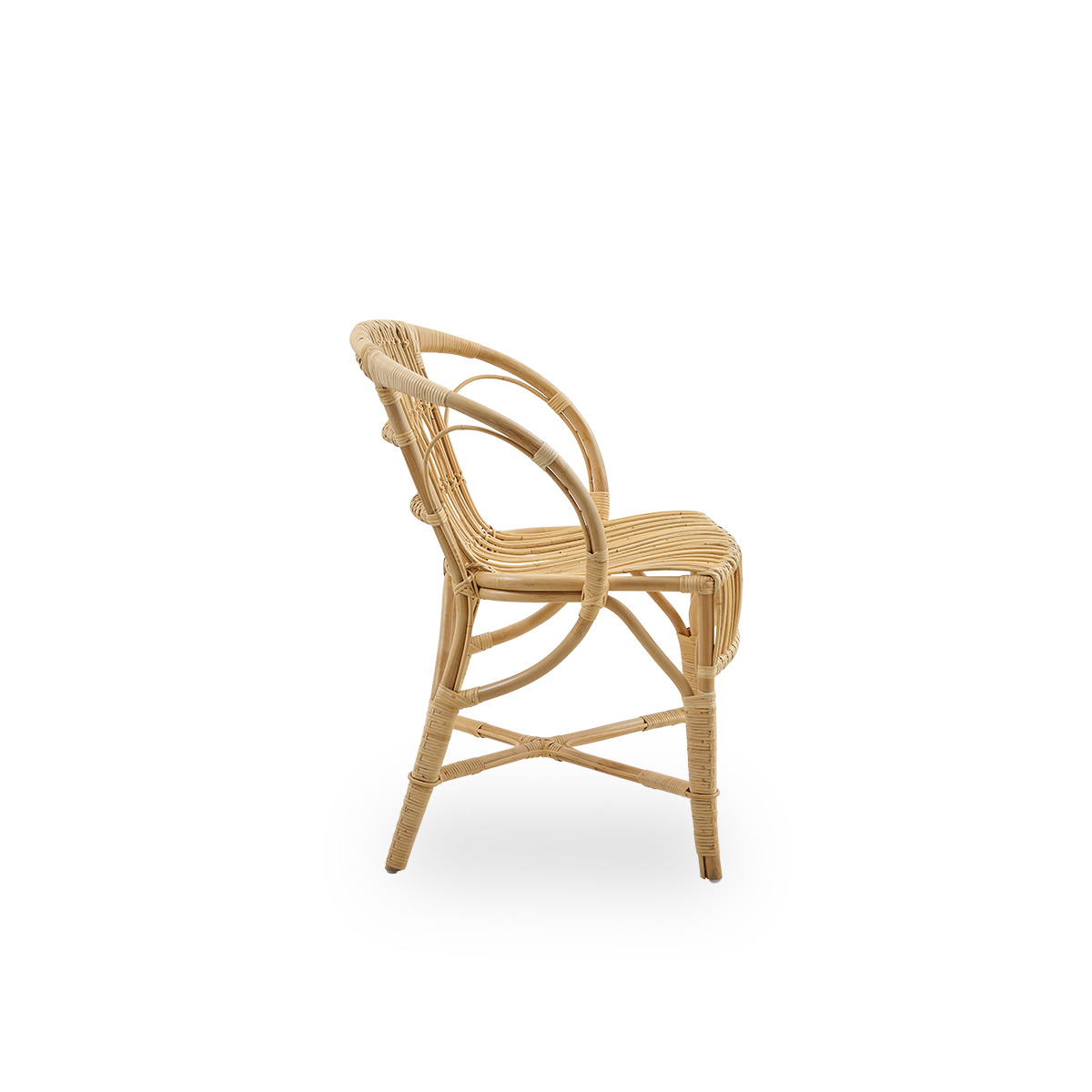 Plain side view of Robert dining chair in natural color designed by Robert W. Elegant wicker chair handcrafted from high-quality Indonesian rattan.