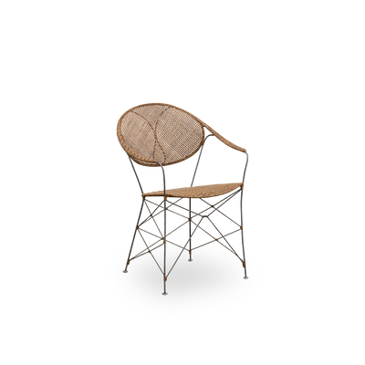 Side view of the Funky dining chair designed by Yuzuru Yamakawa. The chair has a steel frame with handwoven seat and backrest in high quality Indonesian rattan in Hazelnut color.