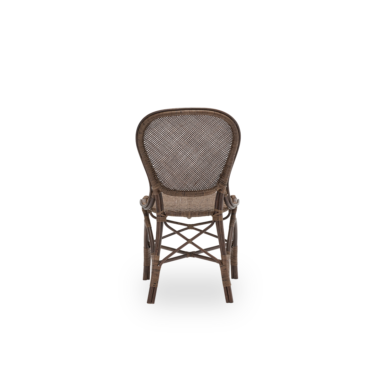 Plain back view of the Rossini dining chair, in brown rattan. Designed in 1993 by Knud Andreasen of Sika-Design together with Japanese designer Yamakawa, it is the brand's signature chair. Handcrafted from high-quality Indonesian rattan.
