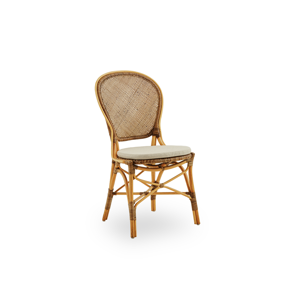 Side view of Rossini dining chair in Cherry color. Elegant wicker chair with round backrest in simple design. Handcrafted from high quality rattan.