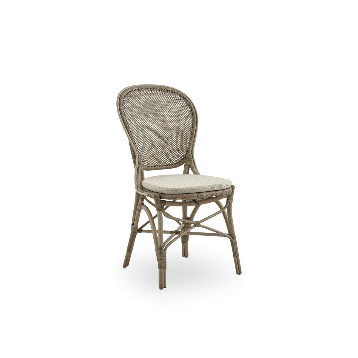 Side view of Rossini dining chair in Taupe color. Elegant wicker chair with round backrest in simple design. Handcrafted from high quality rattan.