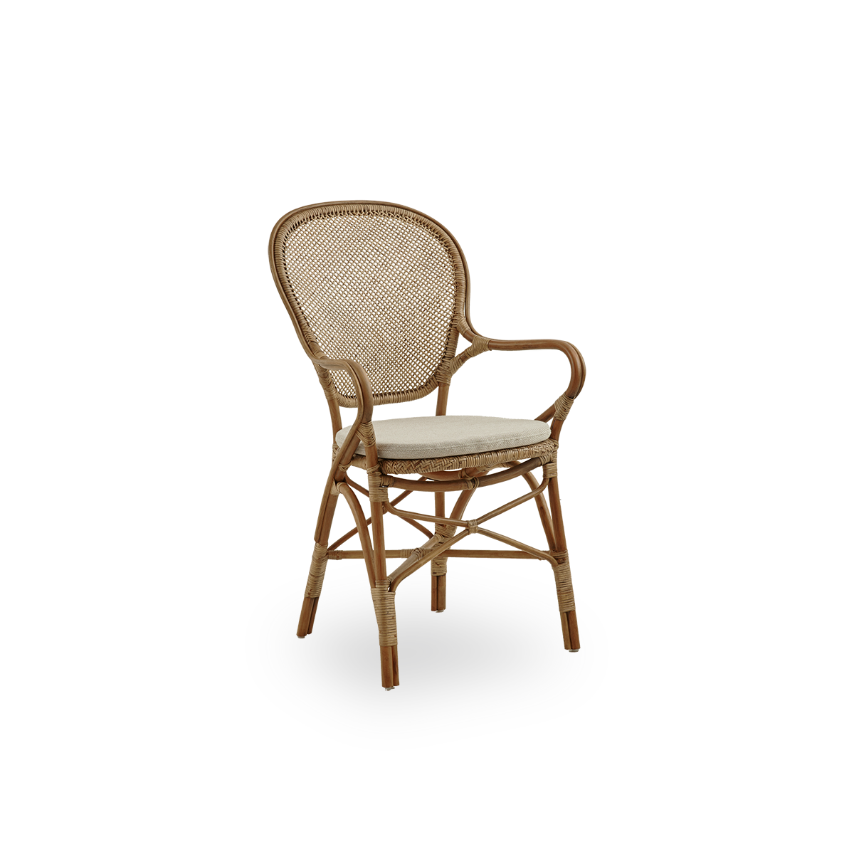 Side view of Rossini dining armchair in antique brown color. Elegant wicker chair with round backrest and armrests in simple design. Handcrafted from high quality rattan.