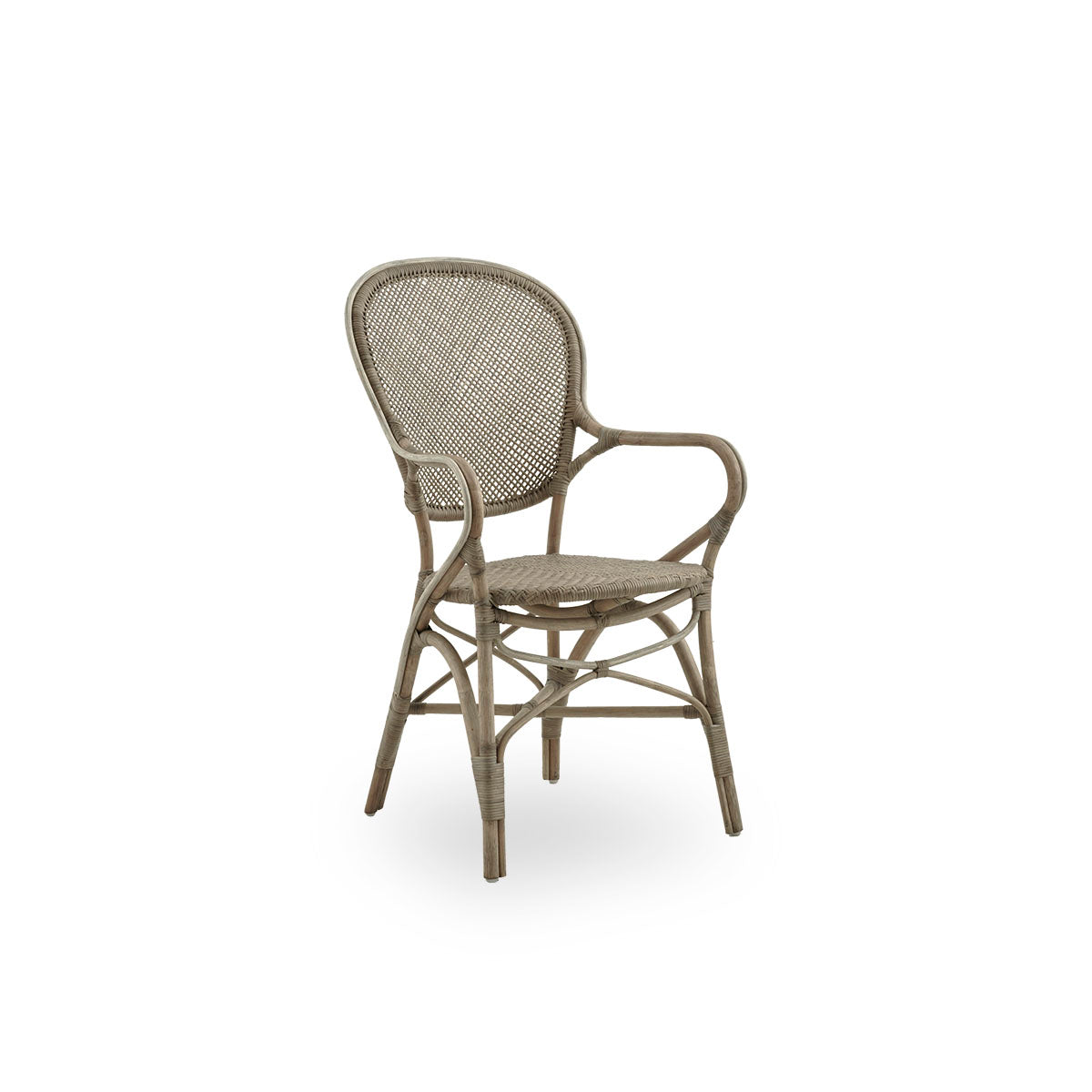 Side view of Rossini dining armchair in Taupe color. Elegant wicker chair with round backrest and armrests in simple design. Handcrafted from high quality rattan.