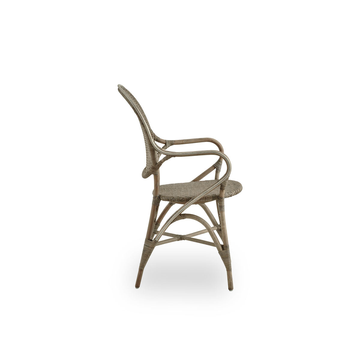 Plain side view of Rossini dining armchair in Taupe color. Elegant wicker chair with round backrest and armrests in simple design. Handcrafted from high quality rattan.