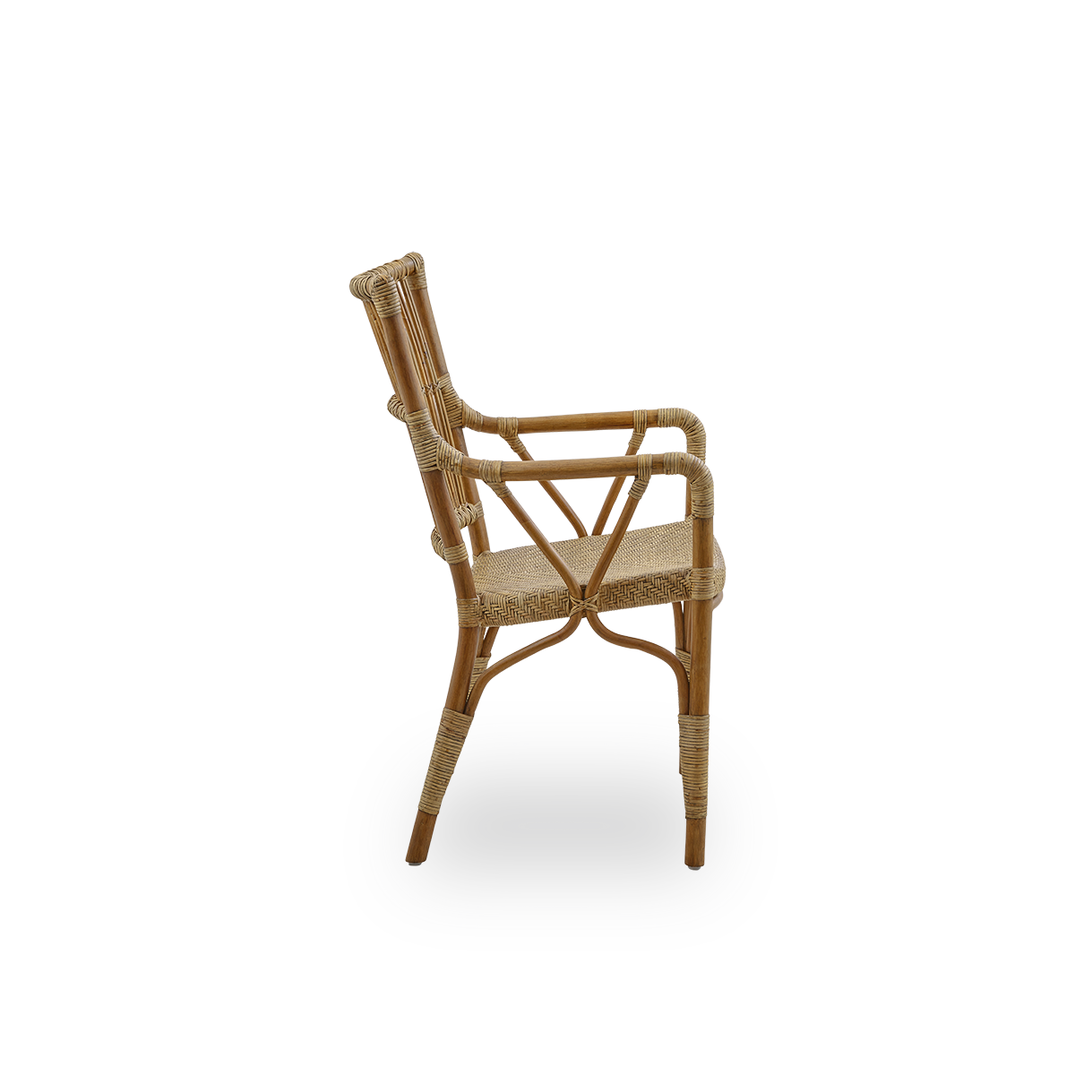 Plain side view of Piano armchair in Antique brown color. Elegant wicker chair with high backrest and armrests handcrafted from high quality Indonesian rattan.