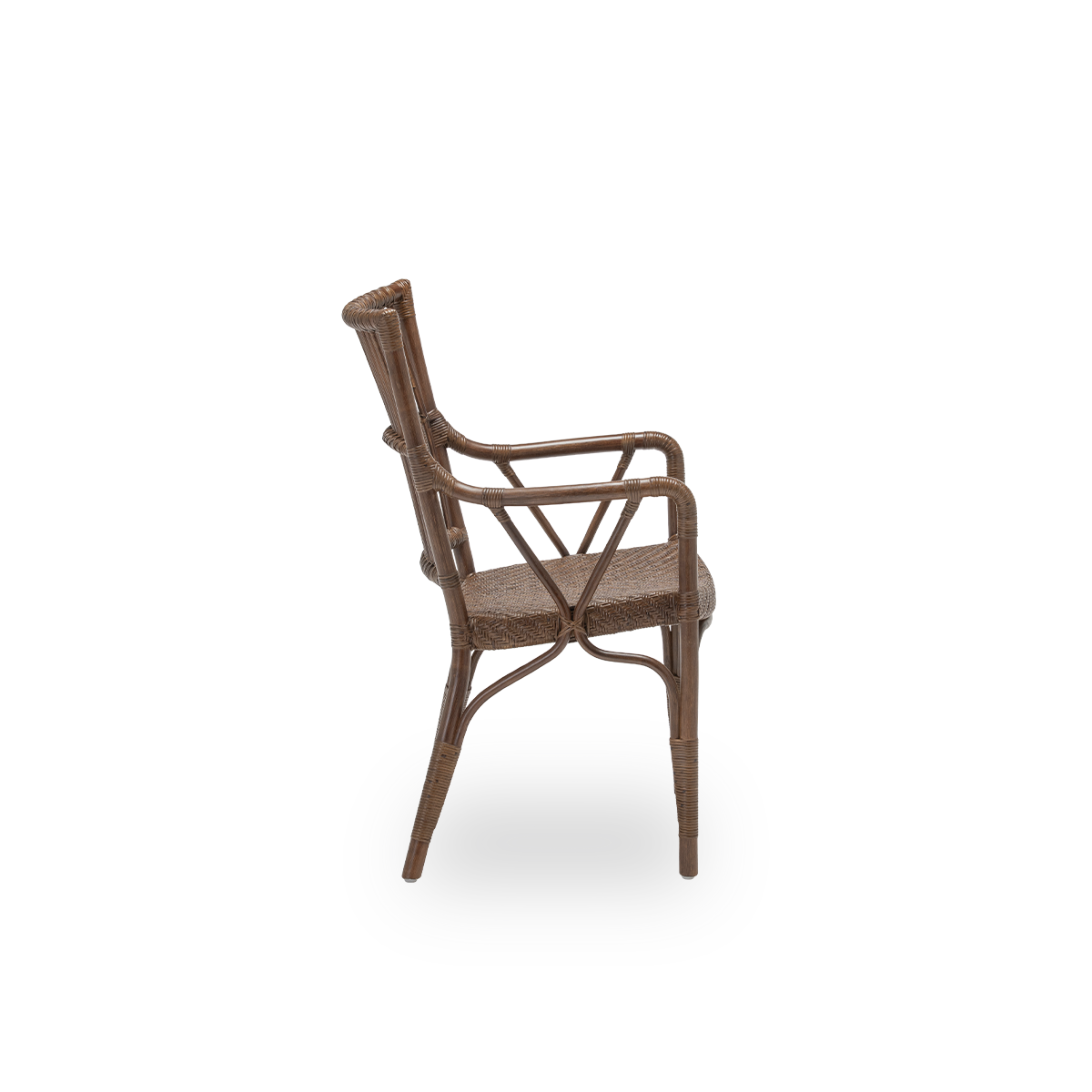 Plain side view of the Piano dining chair, in brown rattan. Danish design from Sika-Design's Originals collection, where the detailed wicker windings give the chair its character. Handcrafted from high-quality Indonesian rattan.