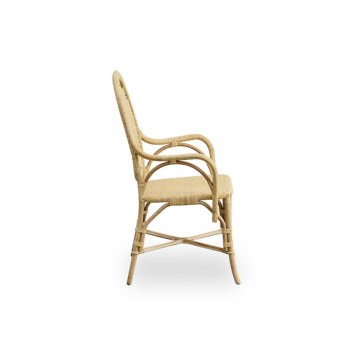 Plain side view of Romantica dining chair in Natural color. Elegant, romantic wicker dining chair with round backrest and fully woven seat in charming Danish design. Handcrafted from high-quality Indonesian rattan.