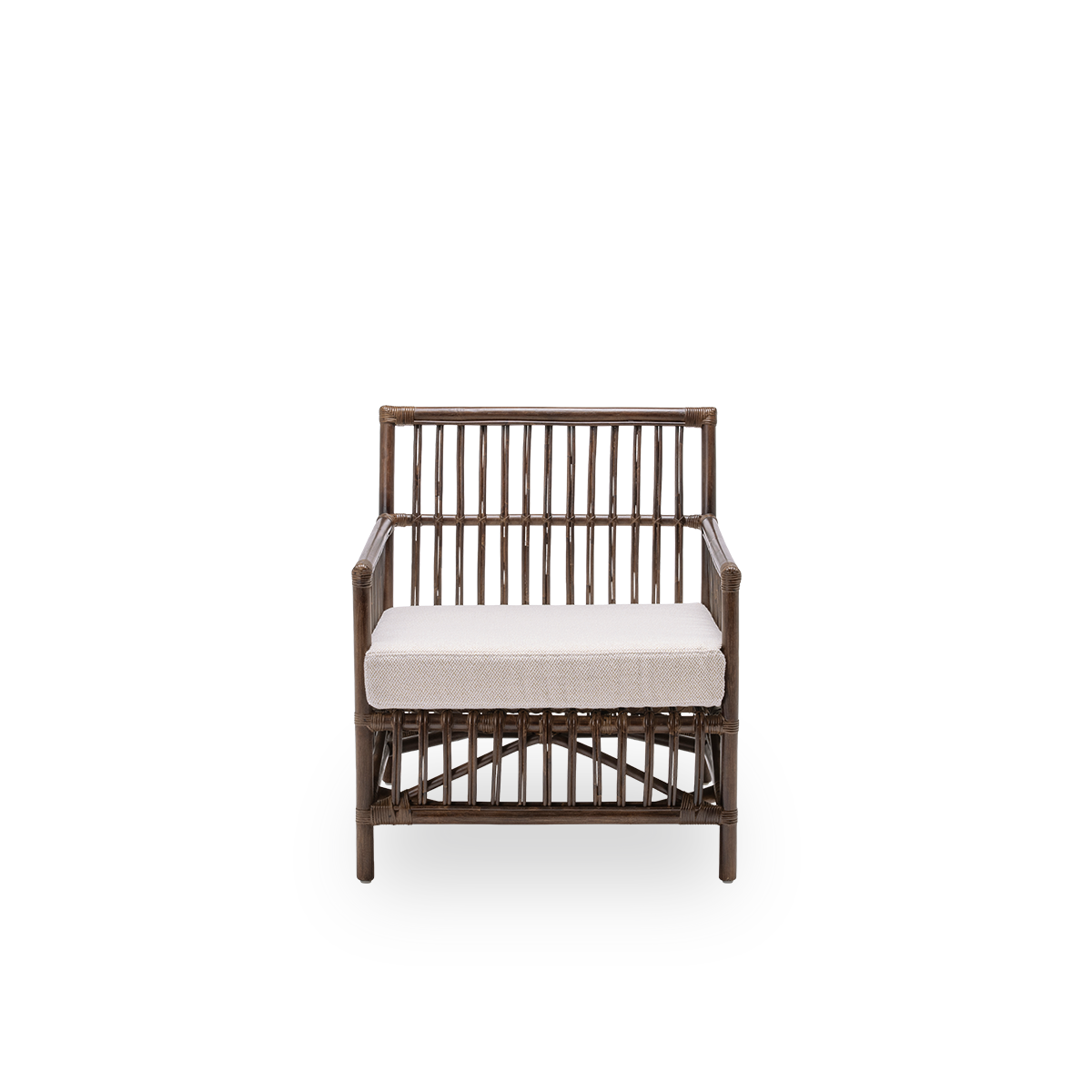 Front view of the Caroline lounge chair with seat cushion, in brown rattan. A simple and elegant Danish design whose detailed windings make it a quiet element in the room. Handcrafted from high-quality Indonesian rattan.