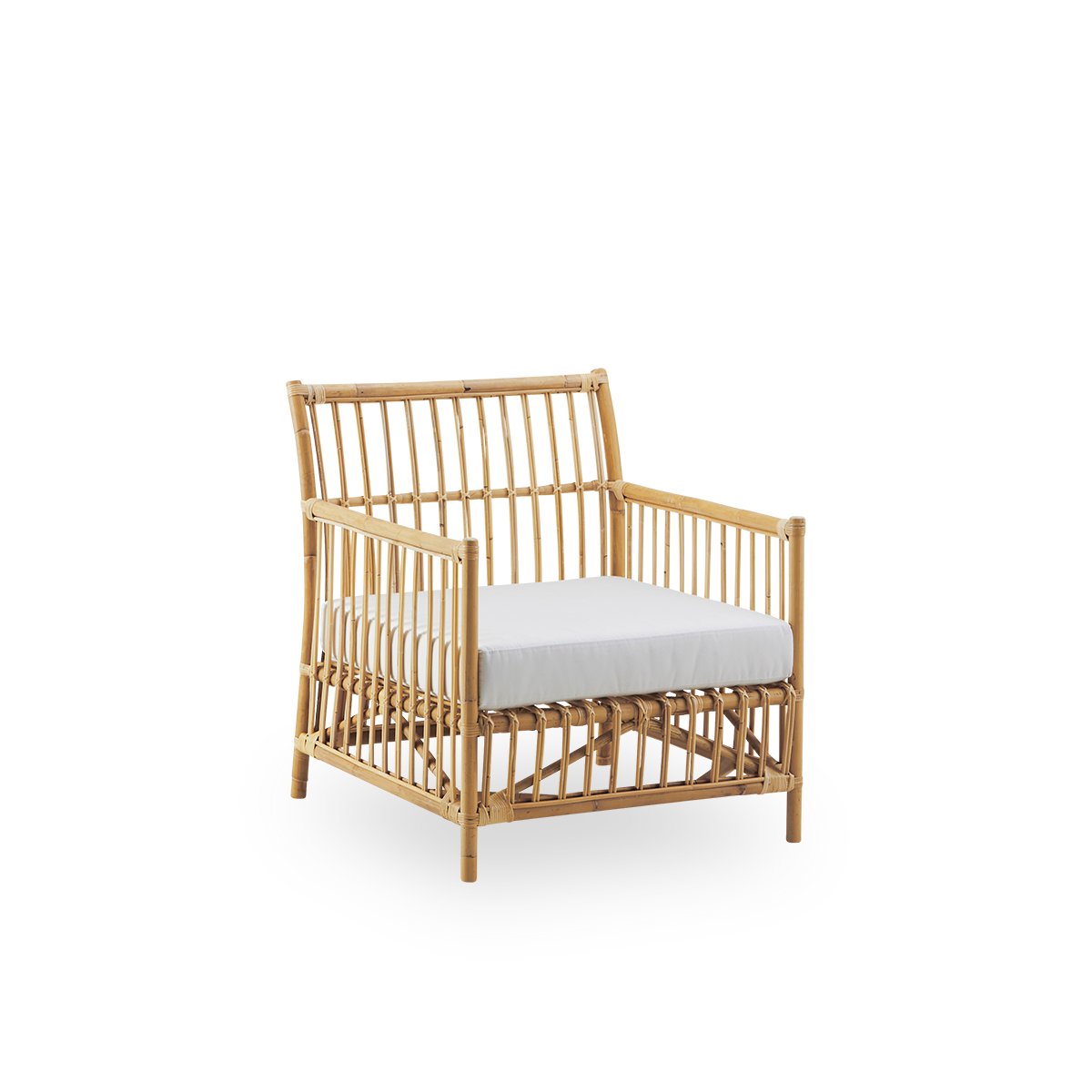 Side view of Caroline Lounge Chair, simple and elegant Danish design. Handcrafted from Indonesian rattan. The chair has a cozy, calming presence.