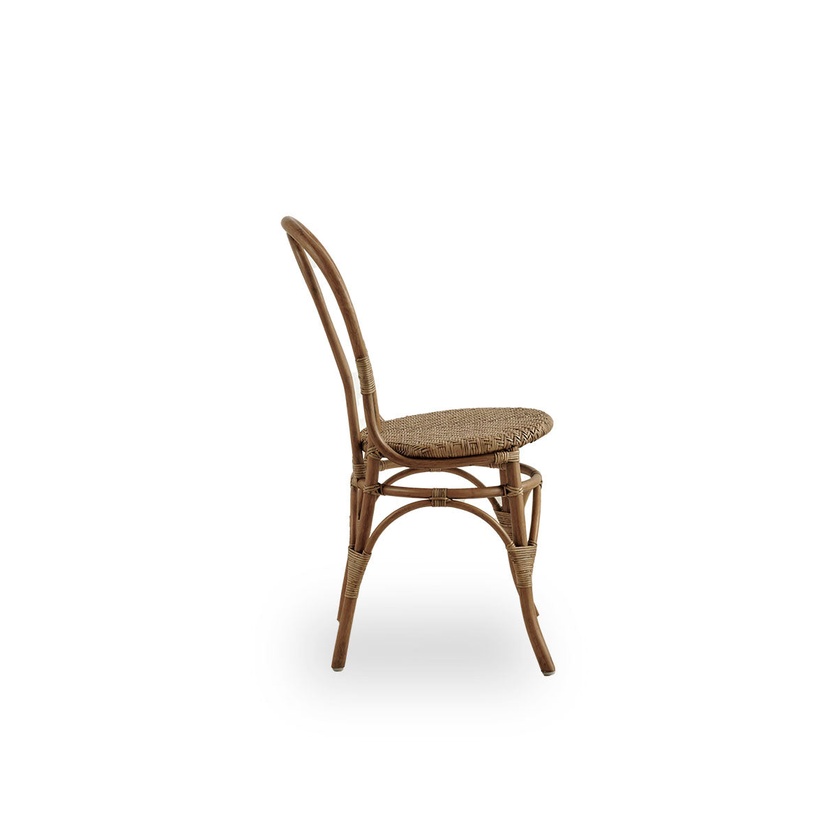Plain side view of Lulu dining chair in Antique brown color, handcrafted from high-quality Indonesian rattan. Lightweight, elegant design with round simple backrest.