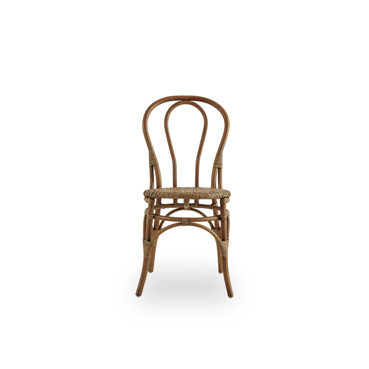 Front view of the Lulu dining chair in antique brown color, handcrafted from high-quality Indonesian rattan.
Lightweight, elegant design with a round and simple backrest.