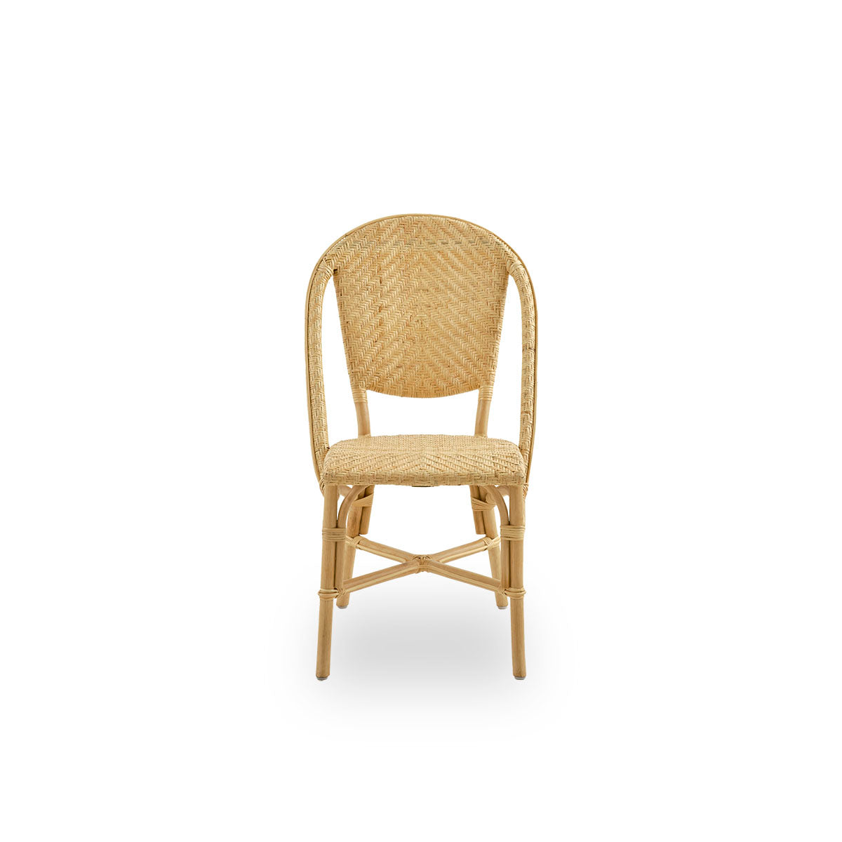 Front view of Alanis dining chair in high-quality natural rattan, featuring elegant curves and detailed weaving.