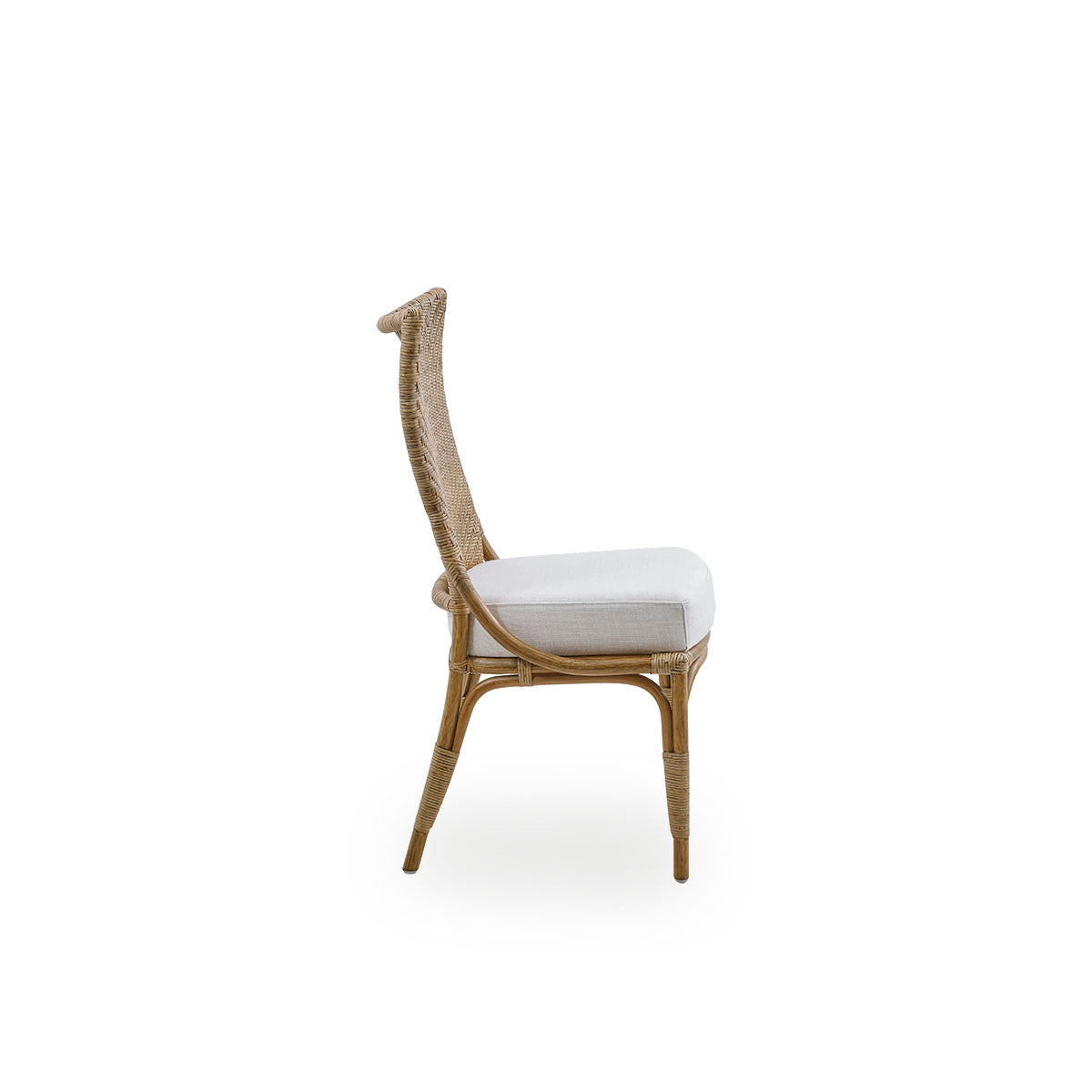Plain side view of Melody dining chair in Antique rattan color with high fully woven rattan backrest and upholstery seat.